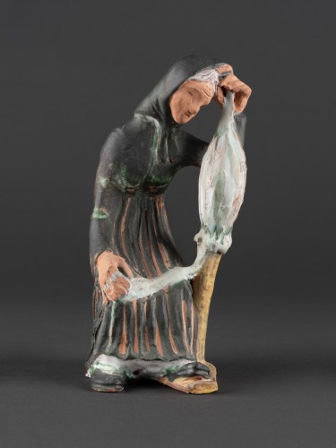 Rokkás öregasszony